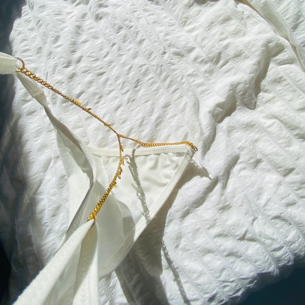 WHITE THONG w/ ‘THAT GIRL’ PEEKABOO LOGO